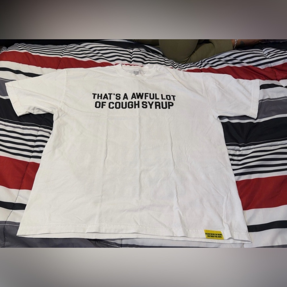 Graphic White Short Sleeve Tee with 'That's a Awful Lot of Cough Syrup'